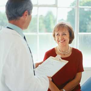 Photo: Middle-aged woman with her doctor